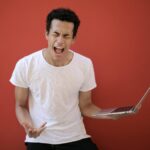 Photo by Andrea Piacquadio: https://www.pexels.com/photo/young-ethnic-male-with-laptop-screaming-3799830/